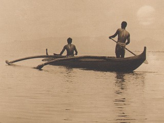 In measured tones subdued and low…