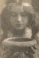 Portrait of Woman Holding up Bowl