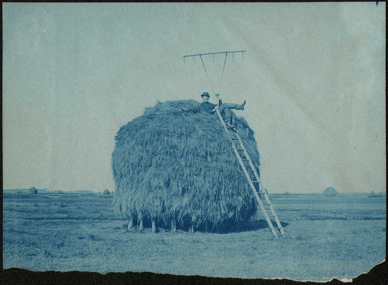 Farmhand atop Salt Marsh Haystack