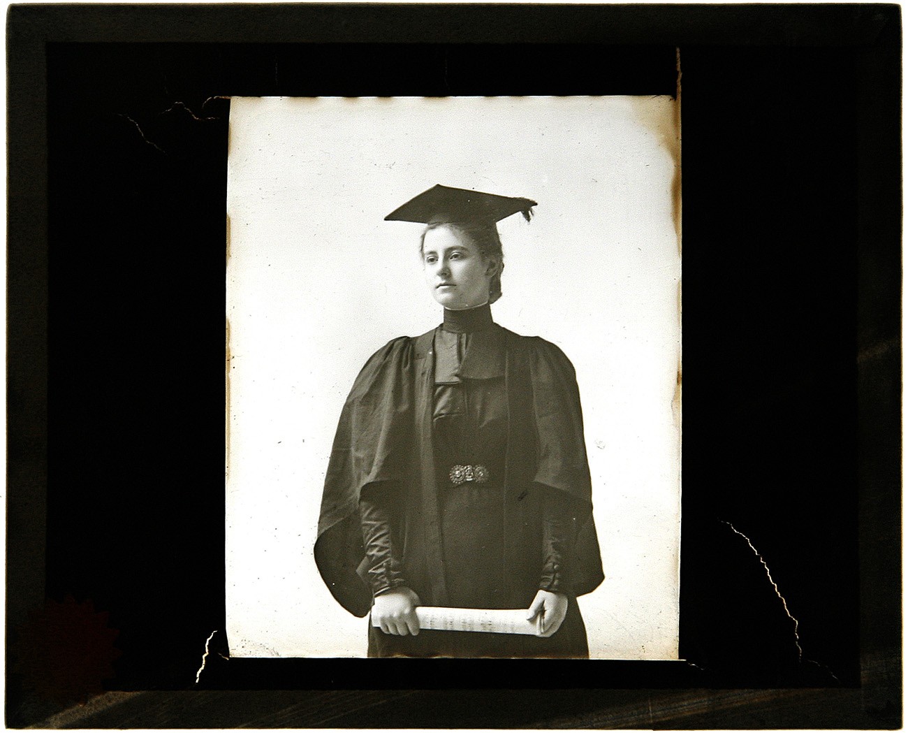 Woman graduate holding Diploma