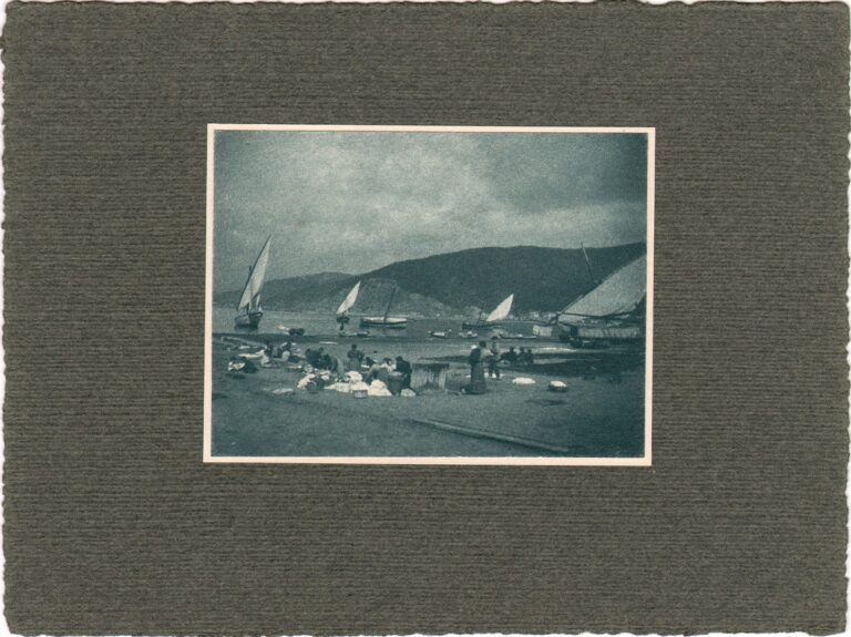 Washing Clothes at Side of Lake