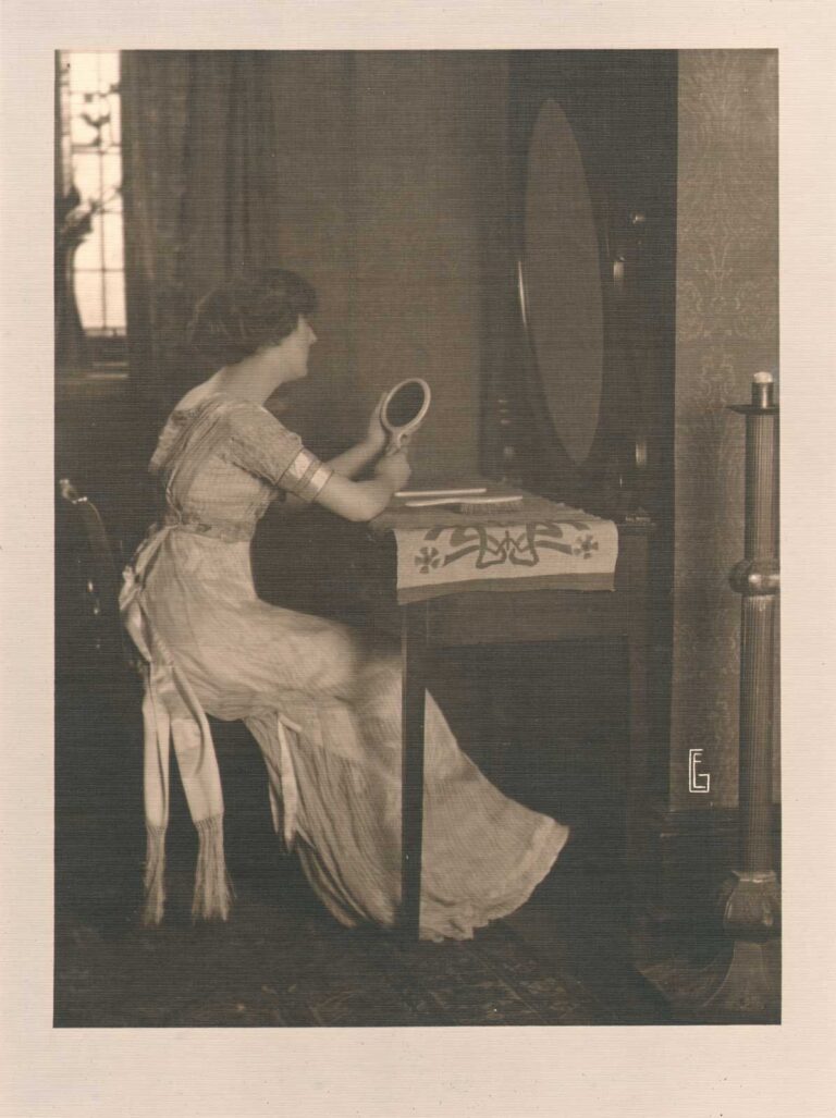 Woman seated at Dressing Table